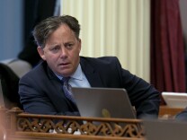 California state Sen. Josh Newman, D-Fullerton, left, listens as lawmakers debate a recall election measure Thursday, Aug. 24, 2017, in Sacramento.