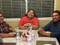Amy Huerta (left), sister Katty and brother Luis Medellin and friends in Lindsay, Calif. Amy is the only member of her immediate family who can vote, but doesn’t. Her brother Luis is trying to change that. 

