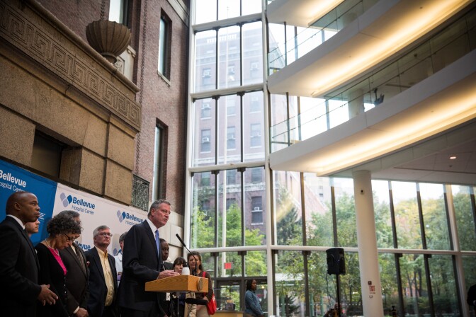 NEW YORK, NY - OCTOBER 26:  New York City Mayor Bill de Blasio speaks at a press conference at Bellvue Hospital regarding the ongoing situation with Dr. Craig Spencer, who is being treated in New York after contracting Ebola while working with Doctors Without Borders in West Africa, on October 26, 2014 in New York City. The state of New York, along with New Jersey and Illinois, recently instituted a mandatory quarantine period for anyone in direct contact with Ebola patients returning from West Africa. The White House has asked the states to reconsider the mandatory quarantine.  (Photo by Andrew Burton/Getty Images)