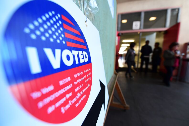 An I voted sticker appears in the foreground