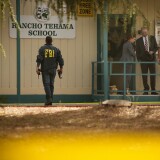 TOPSHOT - FBI agents are seen behind yellow crime scene tape outside Rancho Tehama Elementary School after a shooting in the morning on November 14, 2017, in Rancho Tehama, California
Four people were killed and nearly a dozen were wounded, including several children, when a gunman went on a rampage at multiple locations, including a school in rural northern California. / AFP PHOTO / Elijah Nouvelage        (Photo credit should read ELIJAH NOUVELAGE/AFP/Getty Images)