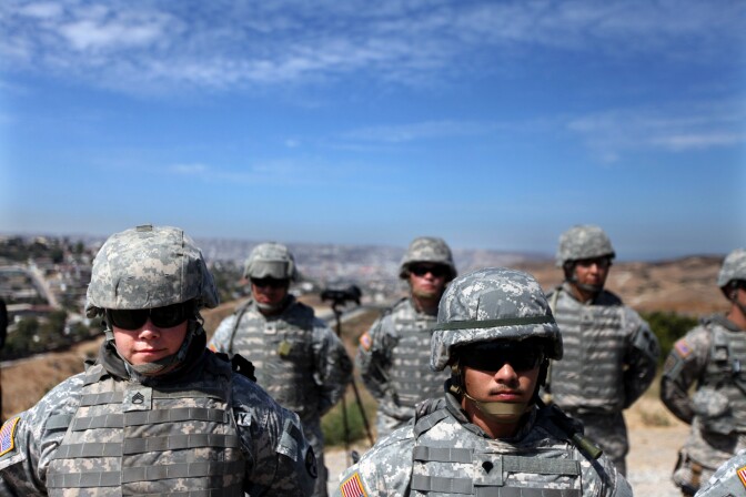 National Guardsmen stand in formation along the U.S.-Mexico border on August 18, 2010 in San Ysidro, California.  