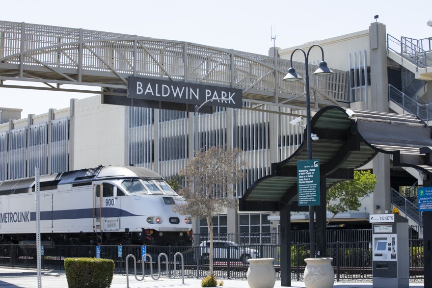 A train pulls into a station in Baldwin Park, CA.
