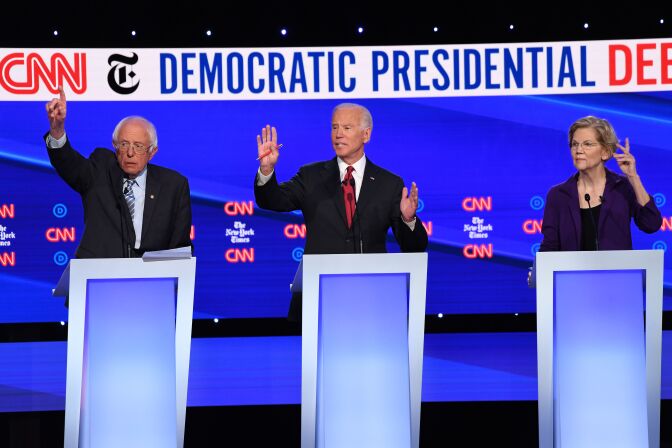 Democratic presidential hopefuls Vermont Senator Bernie Sanders (L), Former Vice President Joe Biden (C), and Massachusetts Senator Elizabeth Warren participate during the fourth Democratic primary debate of the 2020 presidential campaign season co-hosted by The New York Times and CNN at Otterbein University in Westerville, Ohio on October 15, 2019. (Photo by SAUL LOEB / AFP) (Photo by SAUL LOEB/AFP via Getty Images)