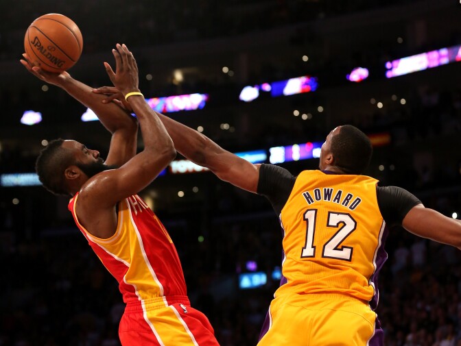 James Harden #13 of the Houston Rockets shoots over Dwight Howard #12 of the Los Angeles Lakers at Staples Center on April 17, 2013 in Los Angeles, California. The Lakers won 99-95 in overtime.  