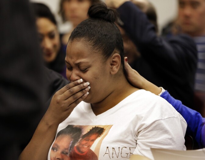 FILE - In this Dec. 20, 2013 file photo, Nailah Winkfield, mother of 13-year-old Jahi McMath, cries before a courtroom hearing regarding McMath, in Oakland, Calif.  McMath remains on life support at Children's Hospital Oakland over a week after doctors declared her brain dead, following a supposedly routine tonsillectomy. 
