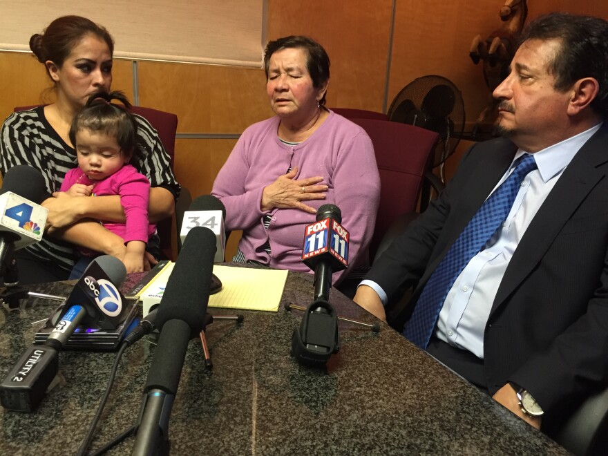 Elvia Marina Aguilar, center, talks to reporters about the killing of her son Noel Enrique Aguilar by LA County Sheriff's deputies. She is flanked by her son's fiance, Mary Herrera and their attorney Humberto Guizar.