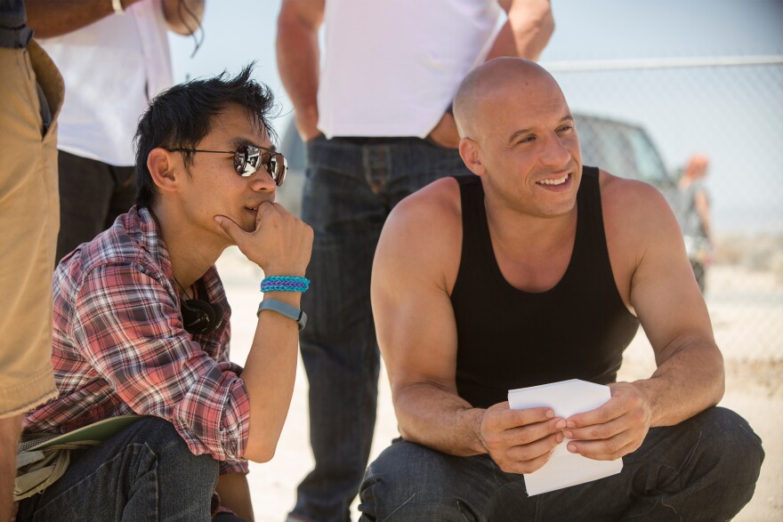 (L to R) Director James Wan and Vin Diesel as Dom Toretto on the set of Furious 7. Continuing the global exploits in the unstoppable franchise built on speed, James Wan directs this chapter of the hugely successful series.