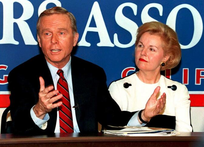California governor Pete Wilson with wife Gayle, announces plans to form a presidential exploratory committee at 23 March press conference in Los Angeles. California briefly allowed flextime when Wilson was Governor in the 1990s. 
