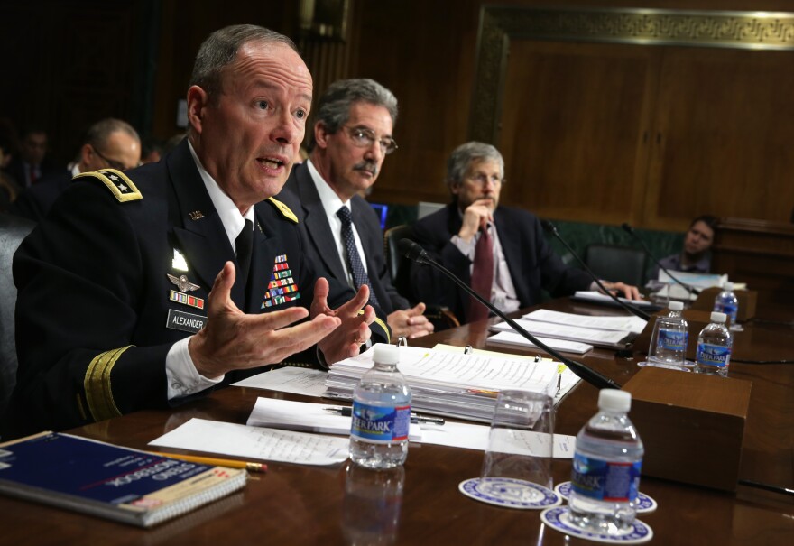 Director of the National Security Agency Gen. Keith Alexander, Deputy Attorney General James Cole, and general counsel of the Office of the Director of National Intelligence Robert Litt testify during a hearing before the Senate Judiciary Committee.