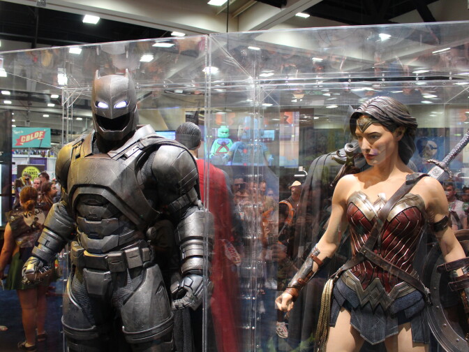 Costumes of Batman in battle armor and Wonder Woman from the upcoming film "Batman v Superman: Dawn of Justice" at San Diego Comic-Con 2015.