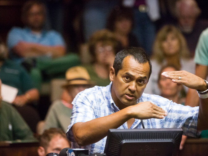 Shark attack survivor Steven Robles speaks during public comment at a city council meeting at Manhattan Beach City Hall on Tuesday night, July 15. Robles explains that he had passed a shark while swimming before, but that the shark on July 5 was frazzled by being caught in a fishing line.