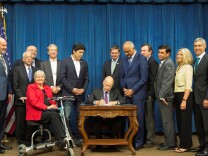 Gov. Jerry Brown signs SB-17 into law on Oct. 9, 2017. The new law requires drug companies to publicly disclose the reasons behind large price increases for prescription drugs, among other provisions. 