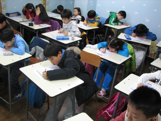 Students taking a test. 