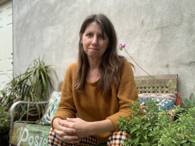 Author and illustrator Rebecca Jordan-Glum wears a light brown sweater.
