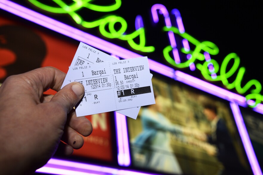 In this photo illustration two tickets for the movie "The Interview" are seen in front of the Los Feliz 3 Cinema in Los Angeles, California on December 23, 2014, where "The Interview" is scheduled to be shown December 25, 2014.