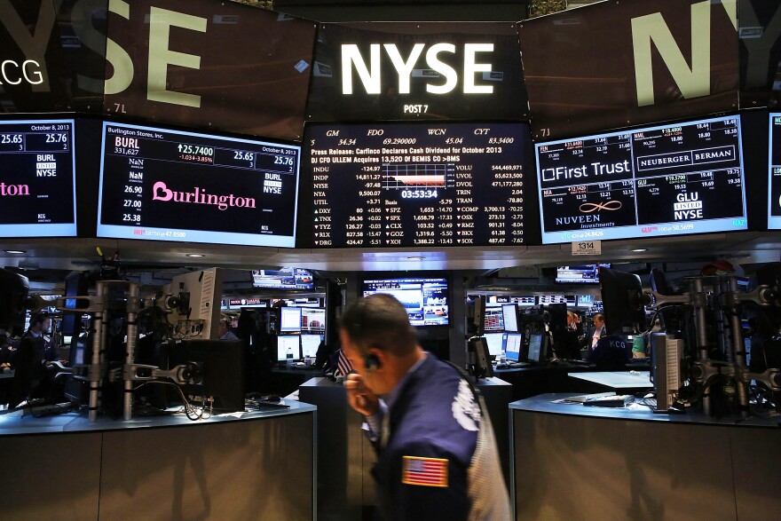 Traders work on the floor of the New York Stock Exchange minutes before the closing bell on October 8, 2013 in New York City. As concerns grow throughout the country and world over the continued U.S. Government shutdown, the Dow Jones Industrial Average and the S&P 500 were both down by close to 1%. The Nasdaq lost close to 2%.  