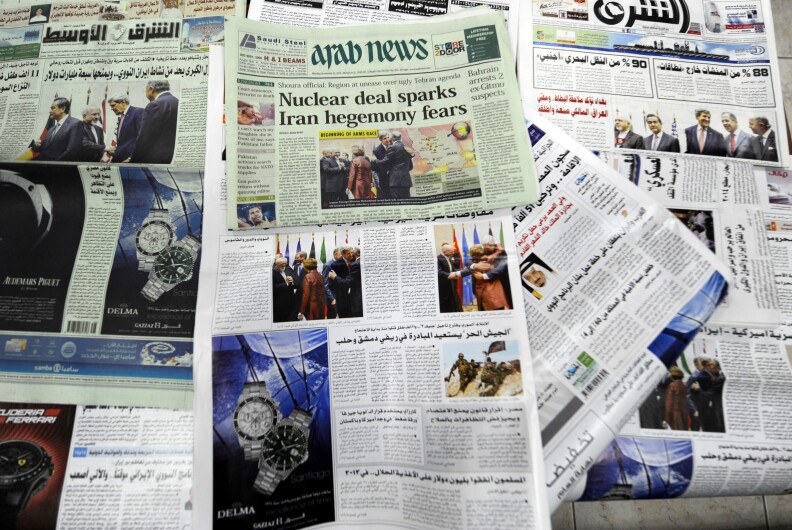 Saudi newspapers headlining the deal made with major powers over Iran's disputed nuclear deal are seen on November 25, 2013 in the capital Riyadh. The accord the United States and its allies welcomed will put Iran's nuclear enrichment program on hold as talks continue, but it marks only the first stage in fraught negotiations.