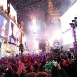 TOPSHOT - Revelers celebrate after the ball drop during New Year's Eve celebrations in Times Square on January 1, 2016 in New York. AFP PHOTO/ KENA BETANCUR / AFP / KENA BETANCUR        (Photo credit should read KENA BETANCUR/AFP/Getty Images)