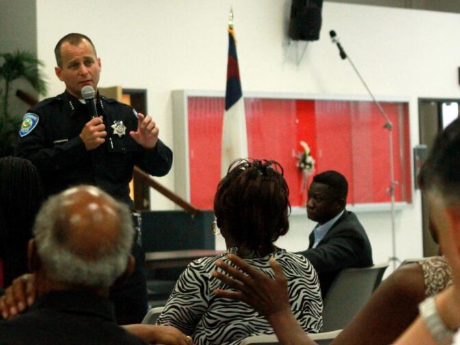 San Bernardino police chief Robert Handy discusses possible cuts in staffing and service at a town hall meeting.