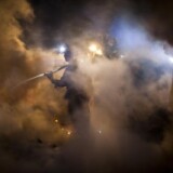 Firefirefighters work to contain and mop-up a fire during a massive fire in a residential neighborhood September 9, 2010 in a San Bruno, California. 
