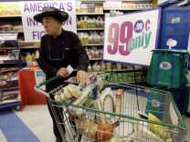 The Commerce Department Thursday said the U.S. economy grew at a modest 2.4 percent annual rate from January through March, slightly slower than initially estimated. Consumer spending accounts for 70 percent of economic activity as measured by the gross domestic product, the economy's total output of goods and services. (Photo: A shopper at a 99 Cents Only Store in Los Angeles). 