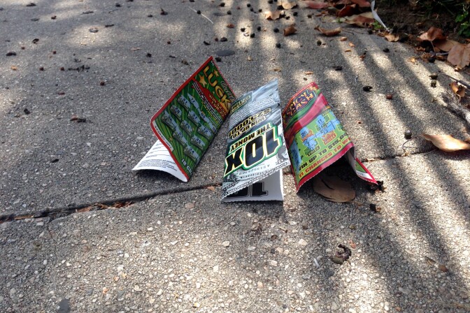Three California Lottery Scratchers tickets, littered on the ground in Los Angeles.