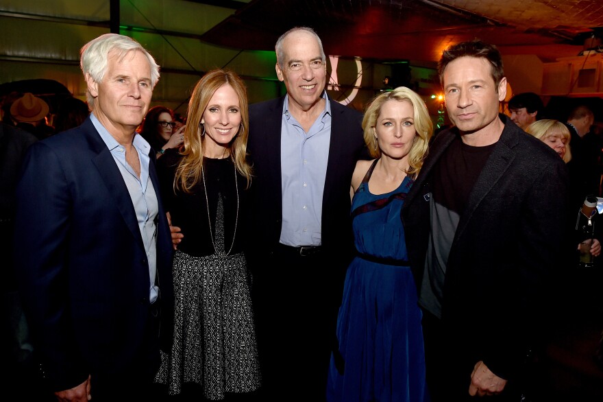 LOS ANGELES, CA - JANUARY 12:  (L-R) Executive producer/director Chris Carter, Dana Walden, Co-Chairman-CEO, Fox Television Group, Gary Newman, Co-Chairman-CEO, Fox Television Group, actress Gillian Anderson and actor David Duchovny pose at the after party for the premiere of Fox's "The X-Files" at the California Science Center on January 12, 2016 in Los Angeles, California.  (Photo by Kevin Winter/Getty Images)