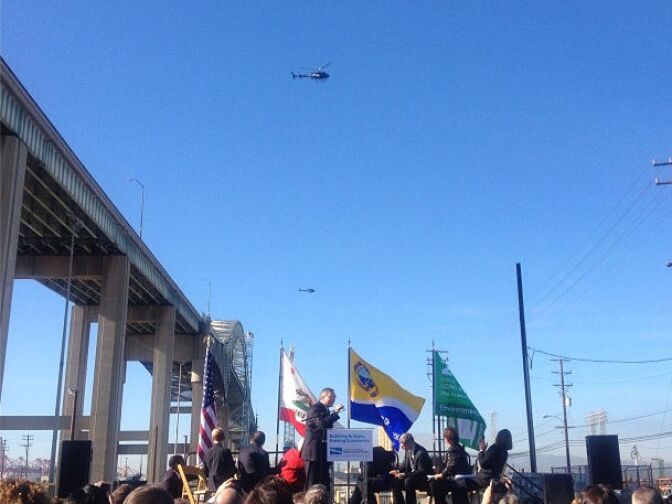 Helicopters are hovering at the height a new bridge linking the Ports of Los Angeles and Long Beach will be built. The flight took place at an event marking the start of construction of the new span on January 8, 2013.