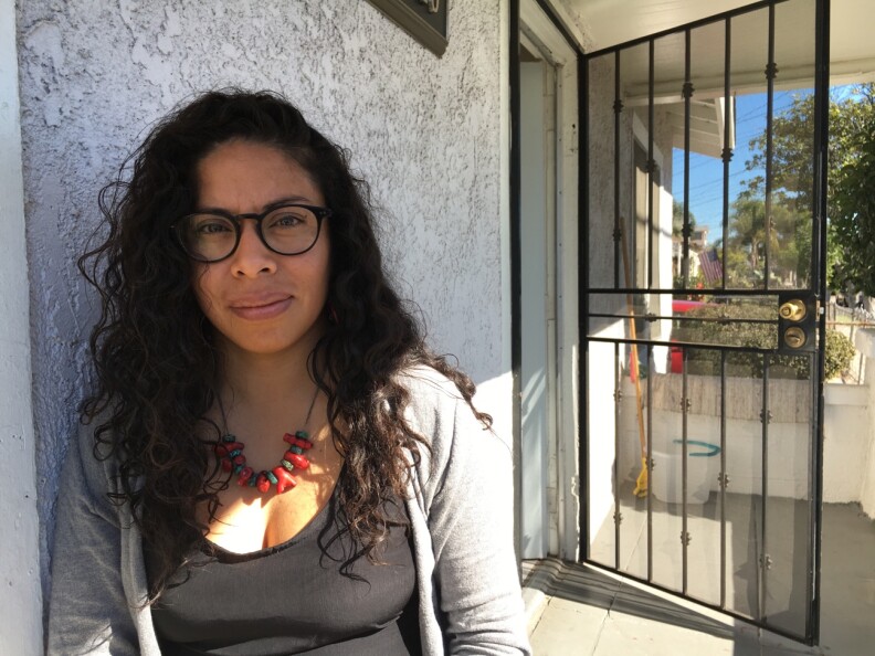 Alma de Jesus, 34, outside her home in East Los Angeles. 