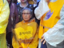 The issue of Japan's use of Korean, Chinese and Southeast Asian women and girls as sex slaves - euphemistically called "comfort women" - continues to alienate Tokyo from its neighbors nearly 70 years after the war's end. (Photo: A South Korean former 'comfort woman' (center), who was forced to serve as a sex slave for Japanese troops during World War II, holds a butterfly-shaped placard reading 'official apology,' during the 1,035th weekly protest against Japan in front of the Japanese embassy in Seoul on August 15, 2012.