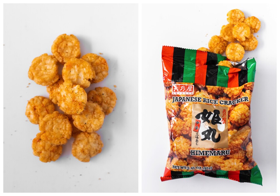A split screen: on the left side is a pile of orange-ish yellow crackers that look like tater-tots. On the right side is a bag with yellow-green and black color blocks., with an image of the rice crackers in the middle. There is a small red block of Japanese characters and below it is the word Japanese Rice Cracker in English. 