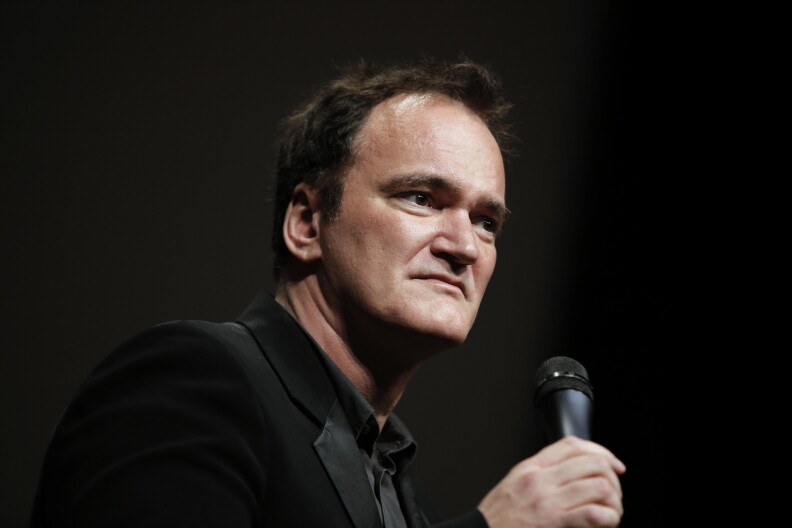 FILE - In this Oct. 18, 2013 file photo, director Quentin Tarantino  delivers a speech before receiving the Lumiere Award during the 5th edition of the Lumiere Festival, in Lyon, central France. Tarantino sued Gawker Media LLC on Monday, Jan. 27, 2014, in Los Angeles for copyright infringement over the site's posting of a story that linked to a leaked copy of his script for a planned film called "The Hateful Eight." (AP Photo/Laurent Cipriani, File)