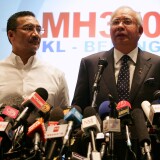 KUALA LUMPUR, MALAYSIA - MARCH 15:  Datuk Hishammuddin Hussein (L), acting Minister of Transport and Malaysian Prime Minister Najib Abdul Razak update the media on the search and rescue plan for the missing MAS Airlines flight MH370 during a press conference on March 15, 2014 in Kuala Lumpur, Malaysia. During the press conference the Prime Minister said that investigators had discovered evidence from satellite and radar systems indicating that the communication systems of the aircraft had been intentionally disabled. The search for the plane in the South China Sea has now been abandoned with the focus switching to two flight corridors, the first stretching from the border of Kazakhstan and Turkmenistan to northern Thailand and a second stretching from Indonesia to the South Indian Ocean.The missing aircraft was carrying 227 passengers and 12 crew.  (Photo by How Foo Yeen/Getty Images)