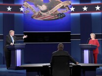 HEMPSTEAD, NY - SEPTEMBER 26:  Republican presidential nominee Donald Trump (L) speaks as Democratic presidential nominee Hillary Clinton (R) listens during the Presidential Debate at Hofstra University on September 26, 2016 in Hempstead, New York.  The first of four debates for the 2016 Election, three Presidential and one Vice Presidential, is moderated by NBC's Lester Holt.  (Photo by Drew Angerer/Getty Images)