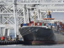 A cargo ship stands on Long Beach harbor, California, in 2012. The Port of Long Beach reported a rise in imports and exports in January 2013 compared to the year before. The Port of Los Angeles reported a decline in both last month. Port clerical workers recently rejected a negotiated contract, raising worry about the possibility of a strike.  