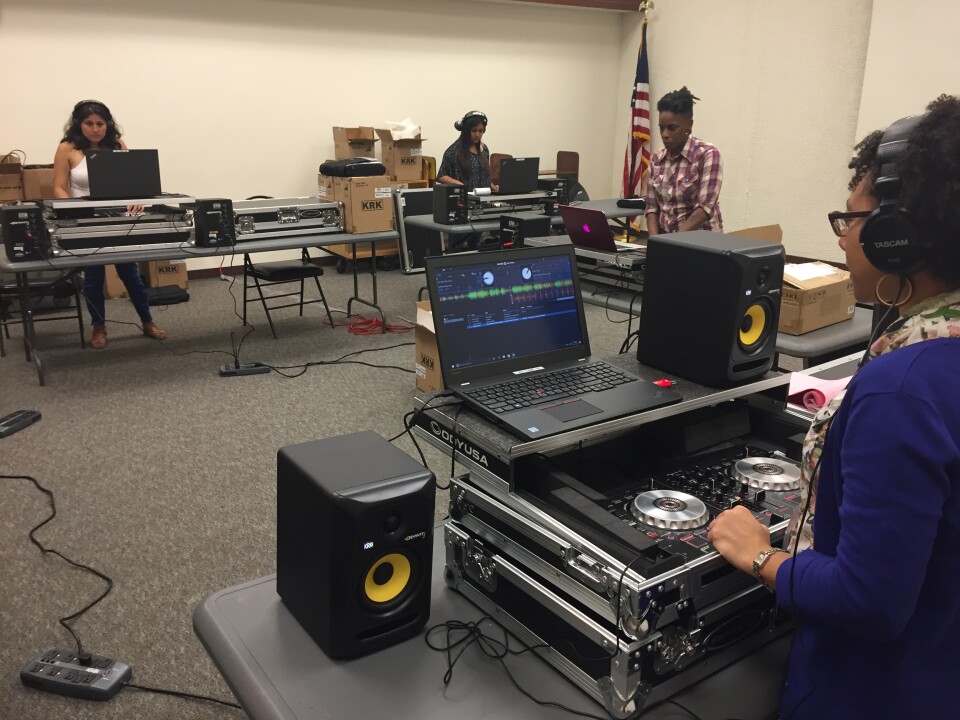 The young DJ's work on their mixes at the Compton public library.