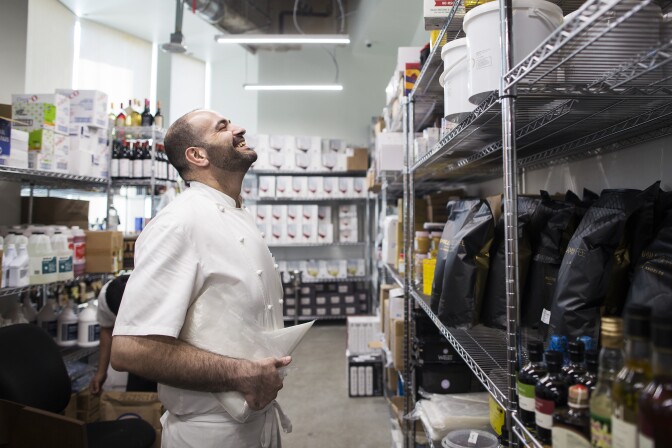 Executive Chef Vartan Abgaryan stands in the dry storage room for 71 Above, the new restaurant on the 71st floor of the U.S. Bank Tower in downtown Los Angeles, on Thursday afternoon, Sept. 22, 2016.