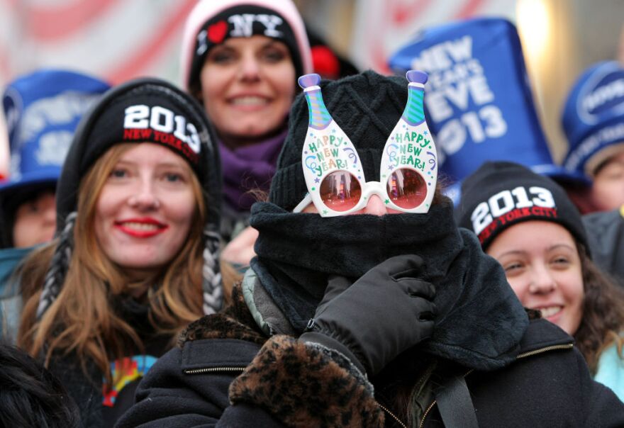 Orly Tzour of Los Angeles wears festive sunglasses as she joins revelers to celebrate New Year's Eve in Times Square on December 31, 2012 in New York City. Approximately one million people are expected to ring in the new year in Times Square. 