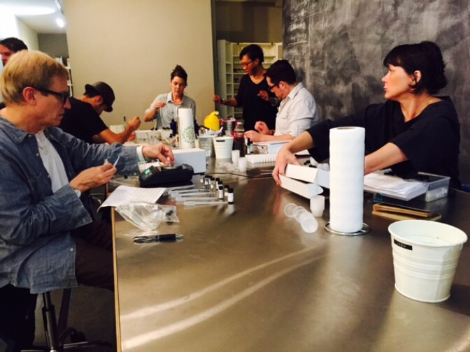 Members of the Smelly Vials Perfume club at the Institute for Art and Olfaction in Koreatown; Saskia Wilson-Brown sits at the head of the table 