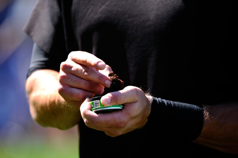 LOS ANGELES, CA - MARCH 31:  Pat Burrell #5 of the San Francisco Giants uses smokeless tobacco during warm ups prior to playing the Los Angeles Dodgers on Opening Day at Dodger Stadium on March 31, 2011 in Los Angeles, California.  (Photo by Kevork Djansezian/Getty Images) *** Local Caption *** Pat Burrell