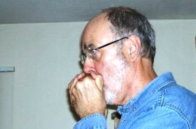 James Sallis, harmonicat and author.