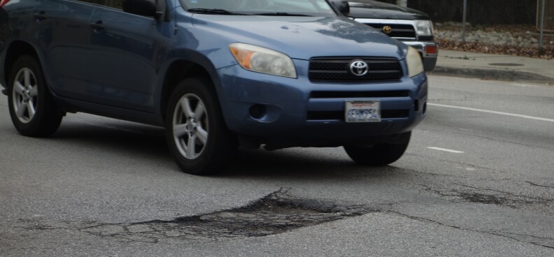 A pothole in the intersection at 8th Street and Bixel Ave. threatens drivers wheels as they cross to get onto the 110 Freeway.