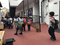 Students dropped their backpacks off on the first day of school at Crete Academy, a new charter targeting homeless students in South L.A.