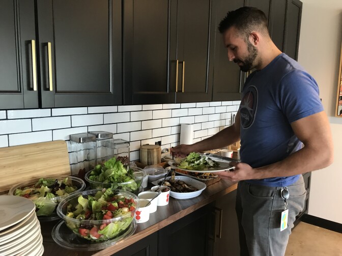 A Tender Greens office employee grabs lunch in their downtown Los Angeles headquarters, March 28, 2018. 