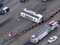 A screencap of the broadcast by NBC-LA of a tour bus crash on Dec. 19, 2013, on Interstate 15 in Corona.