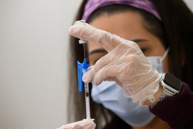 A syringe is filled with a dose of the Johnson & Johnson Covid-19 vaccine at a vaccination site at Baldwin Hills Crenshaw Plaza on March 11.