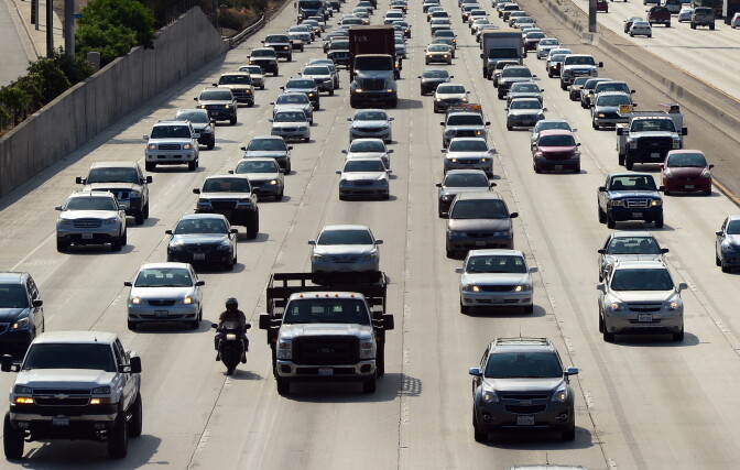Motorists make their way out of downtown Los Angeles headed east on the Interstate 10 freeway on August 30, 2013.