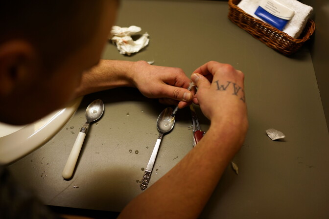 ST. JOHNSBURY, VT - FEBRUARY 06:   Drugs are prepared to shoot intravenously by a user addicted to heroin on February 6, 2014 in St. Johnsbury Vermont. Vermont Governor Peter Shumlin recently devoted his entire State of the State speech to the scourge of heroin. Heroin and other opiates have begun to devastate many communities in the Northeast and Midwest leading to a surge in fatal overdoses in a number of states. As prescription painkillers, such as the synthetic opiate OxyContin, become increasingly expensive and regulated, more and more Americans are turning to heroin to fight pain or to get high. Heroin, which has experienced a surge in production in places such as Afghanistan and parts of Central America, has a relatively inexpensive street price and provides a more powerful affect on the user. New York City police are currently investigating the death of the actor Philip Seymour Hoffman who was found dead last Sunday with a needle in his arm.  (Photo by Spencer Platt/Getty Images)