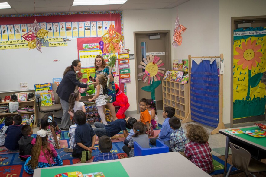 Students wait for a graduation ceremony from a year of classes at Stanley Mosk Elementary School. Some of the students in the class are part of a transitional kindergarten program.